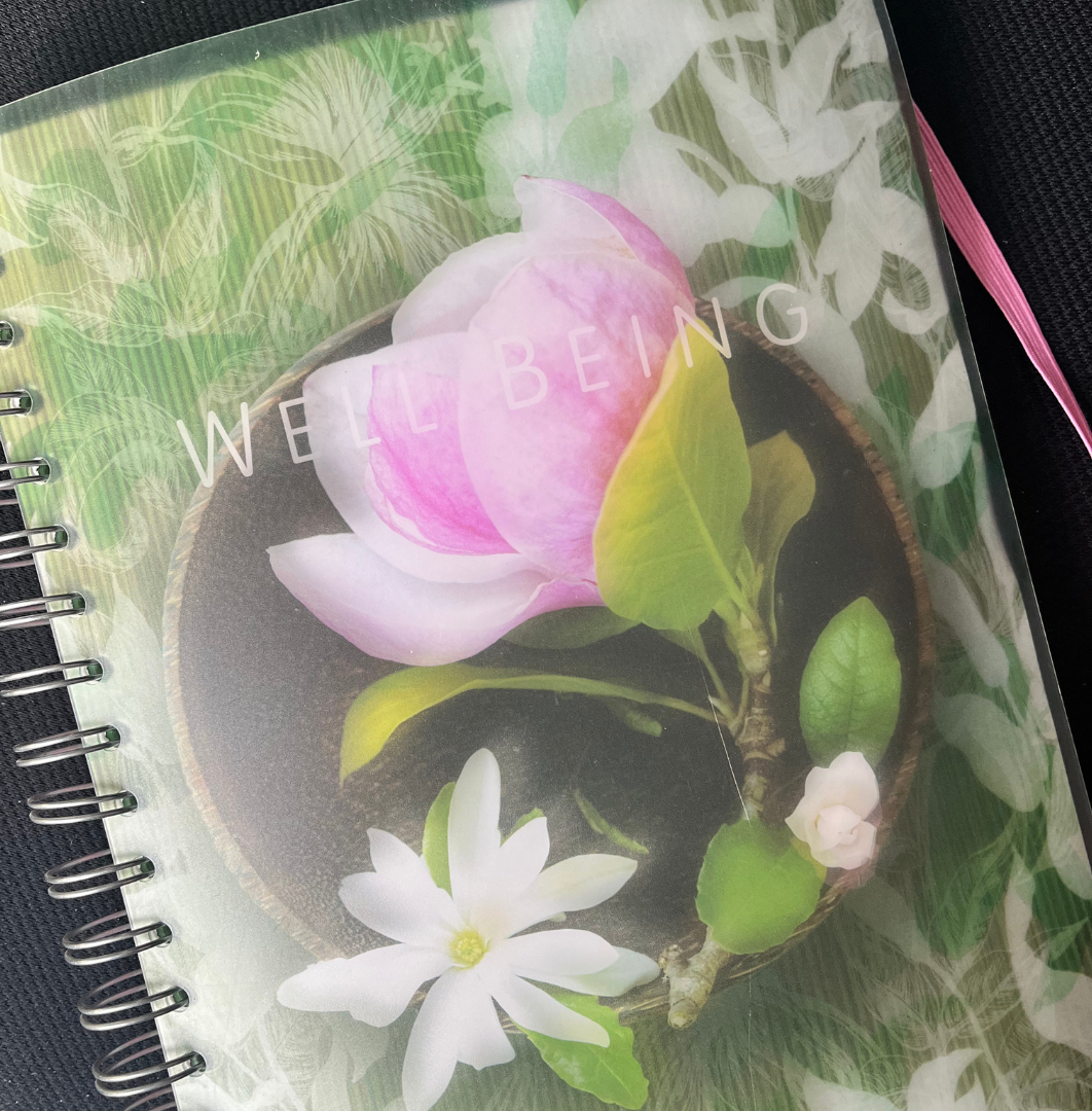 Notebook with a pink flower